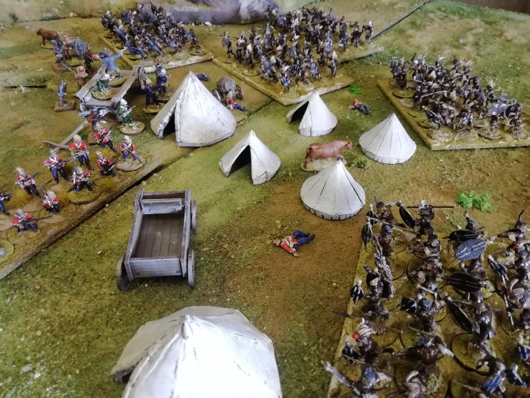 The mass of black shields swarm into the British camp