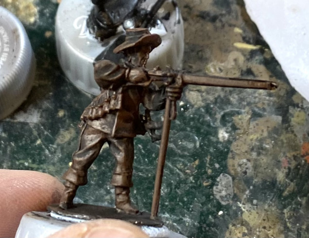 Undercoated figure with a heavy dry brush of Flat Brown.