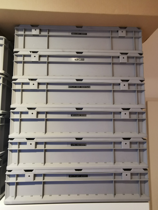 storage boxes piled and labelled