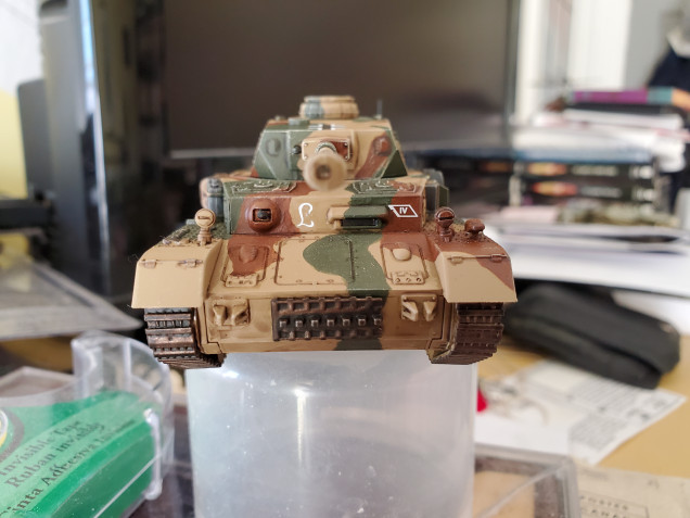 The markings are all decals available with the Warlord kit (which this is) and I went with markings for the Panzer Lehr Division. Not sure how accurate the placement of the markings is as the Germans don't seem to have been as strict with marking placements as the British were, but it works out alright for an overall look. I also went with a Balkenkreuz for the aerial identification symbol just because I'm more comfortable with it as a symbol, though it is not as accurate as a Nazi flag, historically.