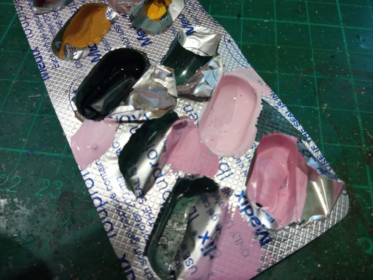 Here is my tiny Pallet. I find an old medicine packet works great for tiny amounts of paint like this that can spread out all over the place on a larger pallet. 