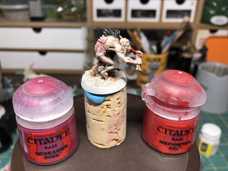 Scars (be thorough in finding them as they are numerous) are painted Screamer Pink with a fine brush. Bones meat and the inside of corpses are painted Mephiston Red for a first gruesome addition to the miniatures. These are ghouls after all!