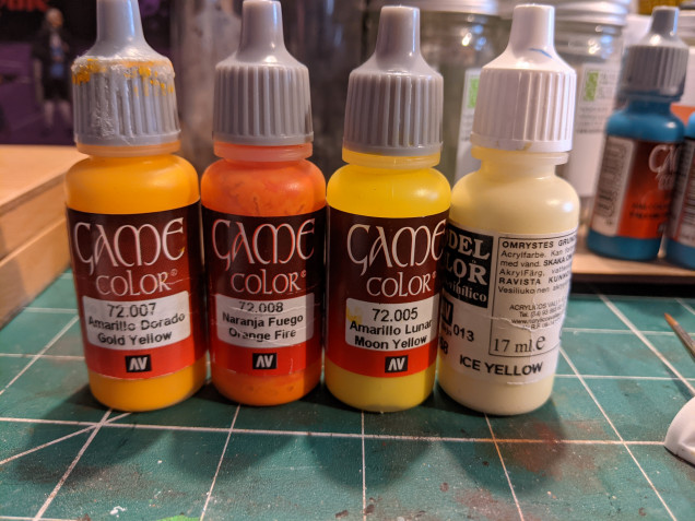 The base coat was Golden yellow, shaded with a mix of the orange.  Highlighting was done with the moon yellow going up to ice yellow at the brightest points.