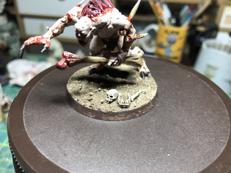 Once on the base, apply a wash of GW Agrax Earthshade, followed by a dry-brush of GW Flayed One Flesh (applied with a small dry-brush).