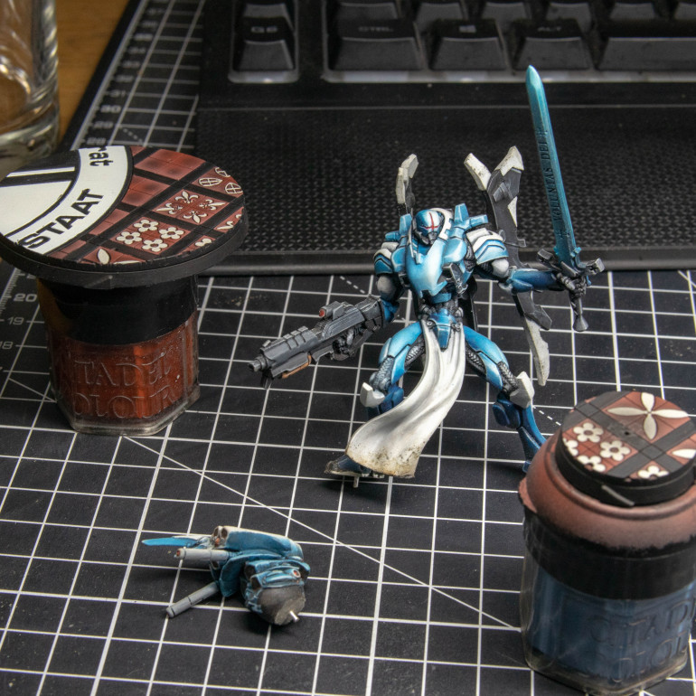 I base painted the bases and I took the two models off their bases. I cut around the outside of the base until it was just the plastic and the tab under the feet. I done this in lots of small cuts and not just chop them off. This worked but I did chip a little paint which was too be expected. I didn’t used to pin everything. I used the tabs. After they were free, I filed the base of the contact point down and drilled for a pin. I used to use paperclips, but they got dangerous, I now just use aluminium wire which is about the same per volume 1 roll and you will never run out.  These are just superglued in. 