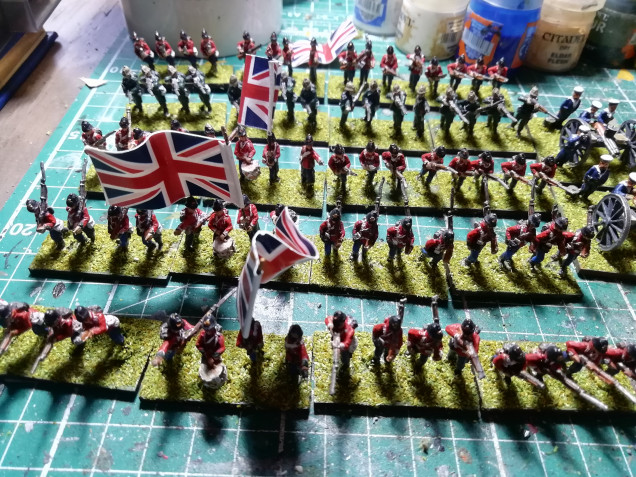 I have relocked my infantry but those big flags need to go. To give them a HG Wells toy soldier look I glossed them up. When painting four units I broke up the red by doing one unit as green rifleman