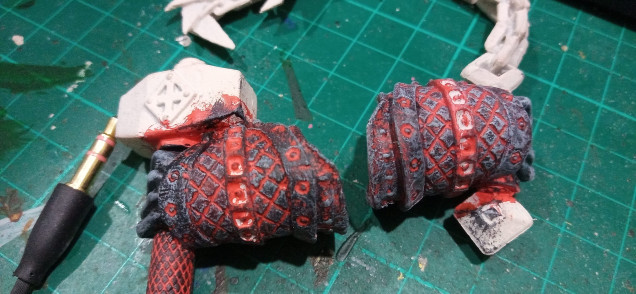 The Left is before the grey drybrush and the right after