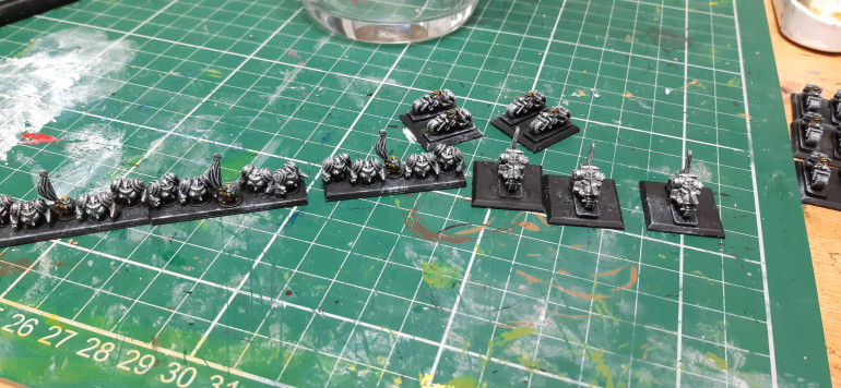 silver dry brush on exo suits on and off bikes. Sliver on normal bikers with brush on the bike frames.