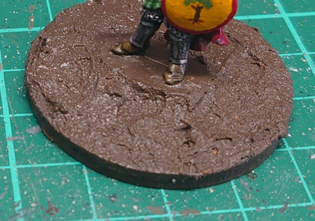 I glued the mini's onto mdf bases, and used Vallejo basing stuff to the base. This was then painted with burnt umber.