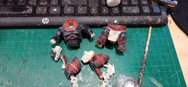 The Skin was painted Black and a rough drybrush of Black of was applied to the armour