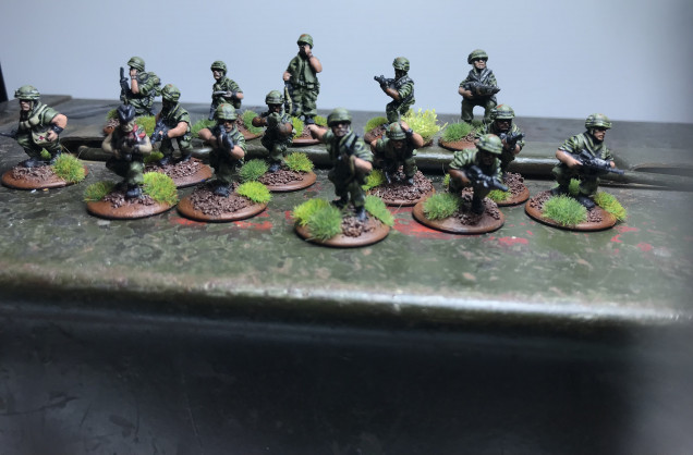 First Rifle squad and command team with attached medic