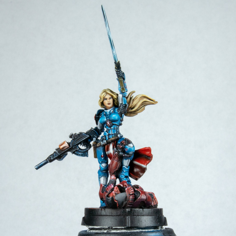 I went ahead and got my turquoise out. I was thinking of going more green on the sword but it didn't look right so painted it again is just turquoise with white and black added and then put in the sword with the side of the brush. You cant see much here. The only thing I did do was create a very almost water consistency of glaze before the final highlight and picked out areas of blue yellow and red depending on what would be reflecting. This is extremely subtle in real life but is lost completely in the pictures I think.