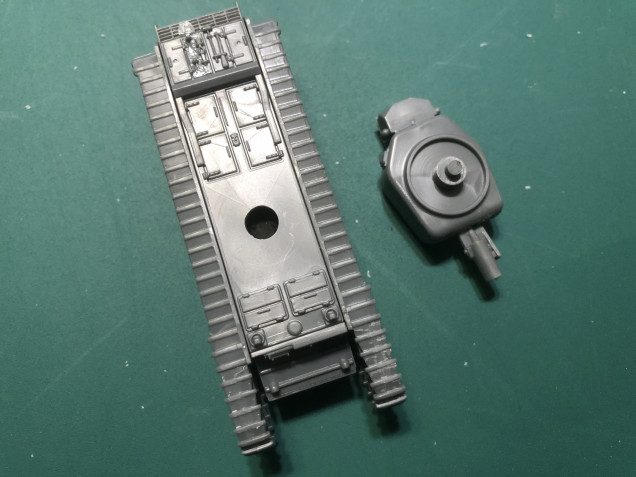 With the hull top glued in place I widened the hole for the turret slightly to allow for any paint that will inevitable get on the turret post and in the hole.