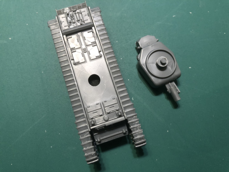 With the hull top glued in place I widened the hole for the turret slightly to allow for any paint that will inevitable get on the turret post and in the hole.