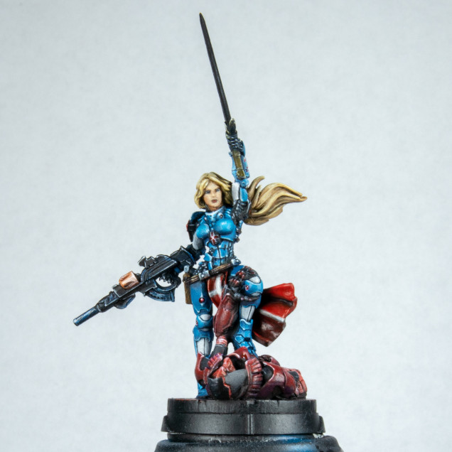 I then painted the Umbra on the base. I wont go into it but it was like painting another model. This did piss me off a little. What is the colour of the base? Red. The colour of the Umbra? Red. It clashes. If I didn't have the army and some of them to paint I would have done this in Necron style green. This also ended up shiny due to the use of the same red in glazes. I then picked out the red components on the armour trying to make a lens effect out of them. finished the gun by adding orange brown and red for my pallet along with white and some washes I used before for the cartridge. I lined the run out in white and added spots of dark Prussian blue washes to areas to give visual interest but not draw the eye to much. I don't like the out hanging gun on the pose but wanted to use that as a line to bring the viewer into the model.