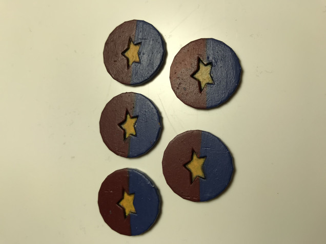 The finished tokens with embossed stars 