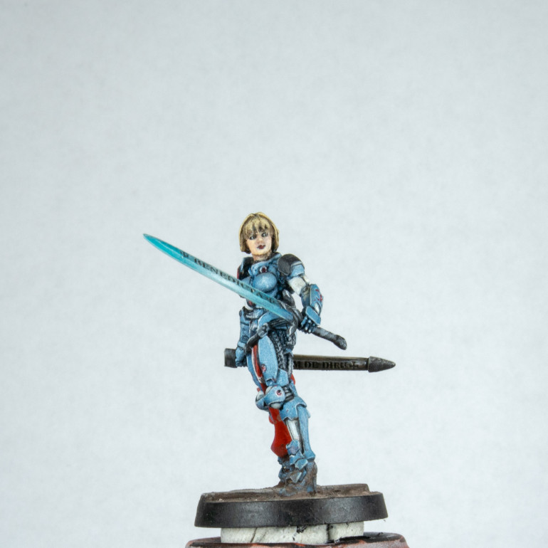 At this point I am finished apart from the varnish. I took the time to look at the model and compare this to my first (technically second) Joan of ark.  The two base models are pretty much the same. I have changed the way I have done things at points all over, I think the only thing that was done the same was the tabard. The mail before I think was over brushed. I highlighted the pano blue so much with white it is a desaturated dull grey blue. I think this took me a week to paint on and off. The other model I painted in a day and a half which is about double what I normally spend. This could have been photography time and thought rather than time with brush on model. I am still pleased with both for different reasons. I have painted a new benchmark in my painting journey and have two reference points I can look at when being too self critical, to ground myself. I still have loads to learn in painting models. I need to do more focused practice but that's hard when I have so many models I want to paint.