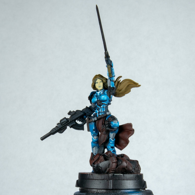 I then go ahead and add white (almost still has blue in it this is to try and keep the saturation of colour) highlights on parts I want to draw attention to. This stage is quite difficult as I have 4 sources of lights. Some of it is done in rule of cool others are considered. I even start to add some reflections in places. This is the most fun when doing armour. I was trying to keep in my mind breaking up each complex object into simple objects and highlighting them accordingly. e.g. spot on spheres and  lines down cylinders. Others it doesn't matter to me and only one half is in the light.