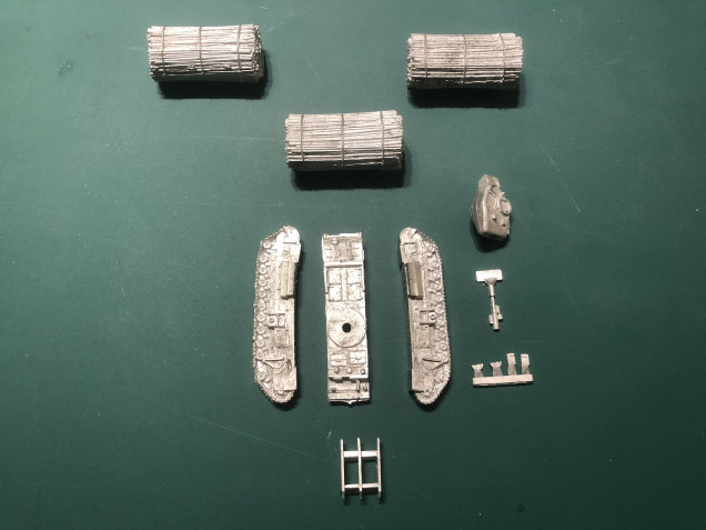 First off I thought I'd look at the Fascine laying AVRE, here are the parts, plus the three Fascines I purchased. They were simply cleared of flash, mated up and then glued. I then did a little bit of trimming, they will still need a bit of filling before they can be painted.