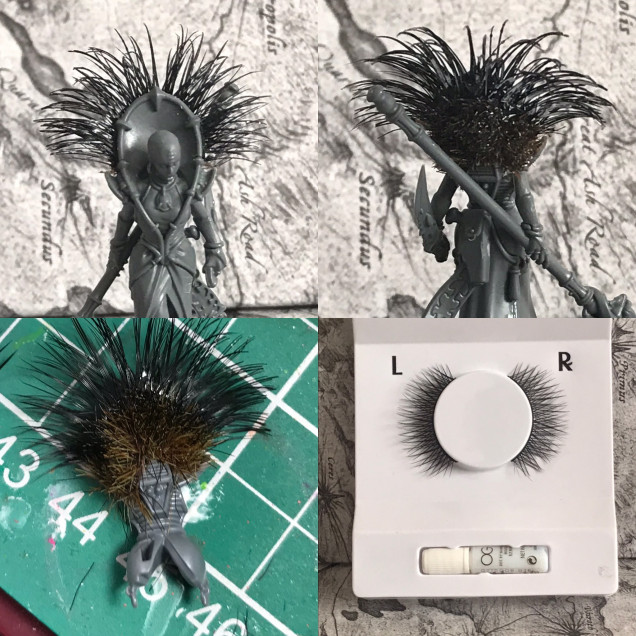 Using false £1 eye lashes I glued them in place from the middle of the head dress to the shoulders . Then glueing grass tuffs trimming and adding thin super glue after to fix in place 