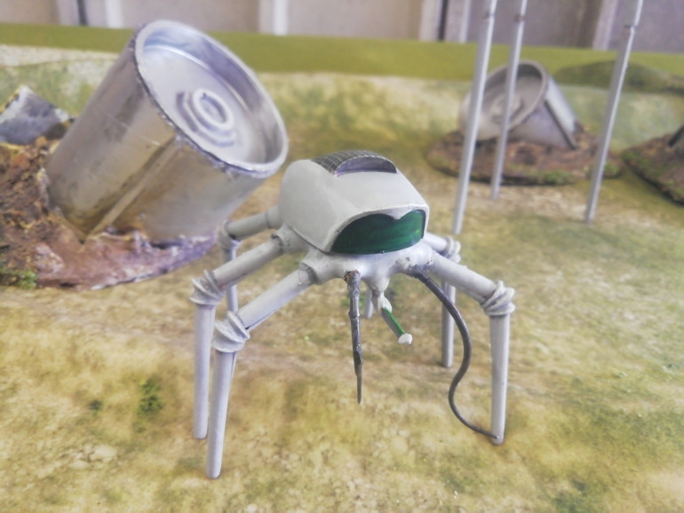In the original book the narrator of war of the world's described a squat metallic machine that chased it's victims and deposited them into the net on its back. They can be fed on later. My machine was s brass colour but I want it to have a more classic look so have repainted it.