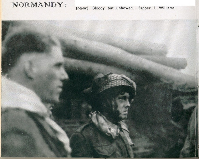 This image shows the battered crew of this AVRE and that it appears that they did not get an opportunity to use their log carpet before their tank was put out of action. Each Assault Squadron had four troops and each was assigned a lane to create in the obstacles, with the aim of completing a cleared lane from the beach to the first lateral metalled track (a road to non-military types) whereupon the lane would become a beach exit.