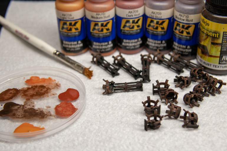 I googled “used firepits” to get an idea for colours. These seemed way brighter than I wanted but it did give me an idea for a quick paint. I primed then used rust texture paint to take away any sign of layer lines. Then stippled (not dry brushed) heavier layers of the darker colours softening to the lighter ones. I then dropped the pile of larger braziers but not to worry the wheel of my chair found it. Lucky I always do spares when I can.