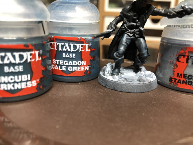 Gallery above - The miniature was then covered with GW Contrast Black Templar - Above - Pants were covered with a thinned out layer of GW Incubi Darkness (as a glaze) then highlighted with GW Stegadon Green and Mechanicus Standard Grey.