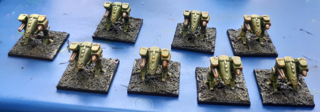 dreadnoughts had another dry brush of dead flesh. Followed by pale burnt metal on the guns. Which is then washed with mid brown. The bases are then coated with cygor brown the dry brushed with khaki then camourflage green. steps shown below