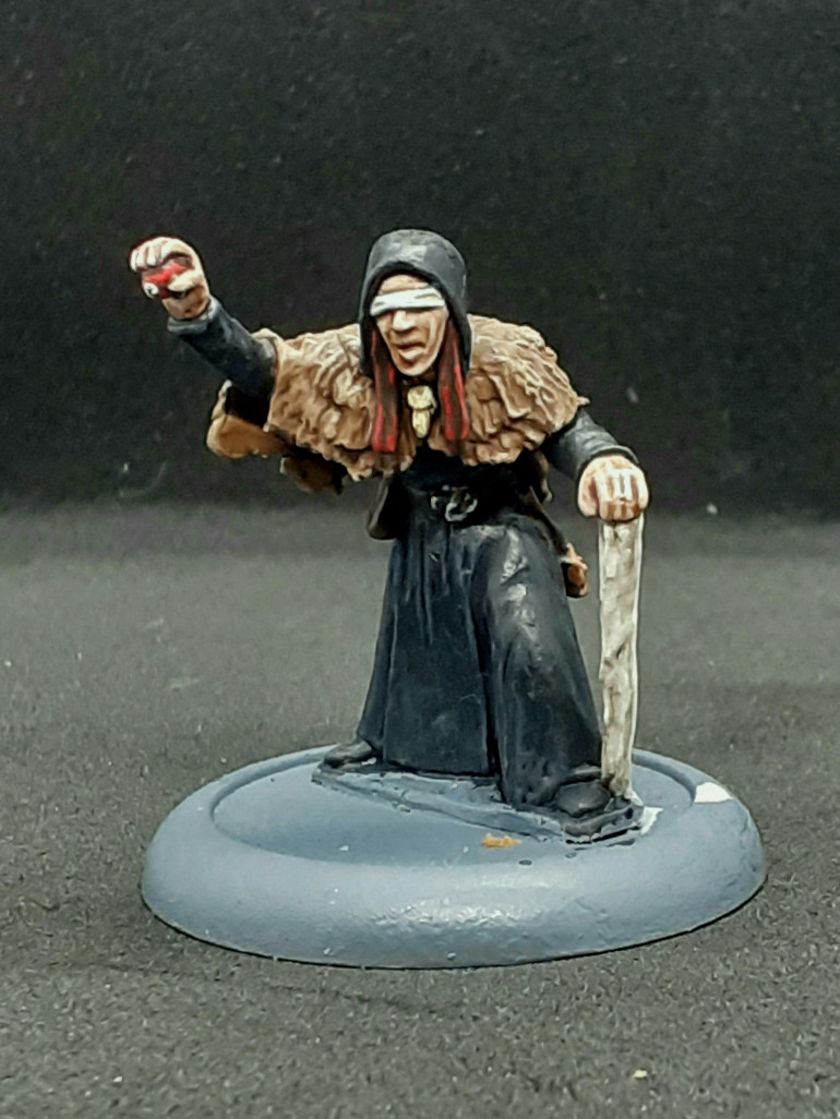 Wife and apprentice  to the Baron.