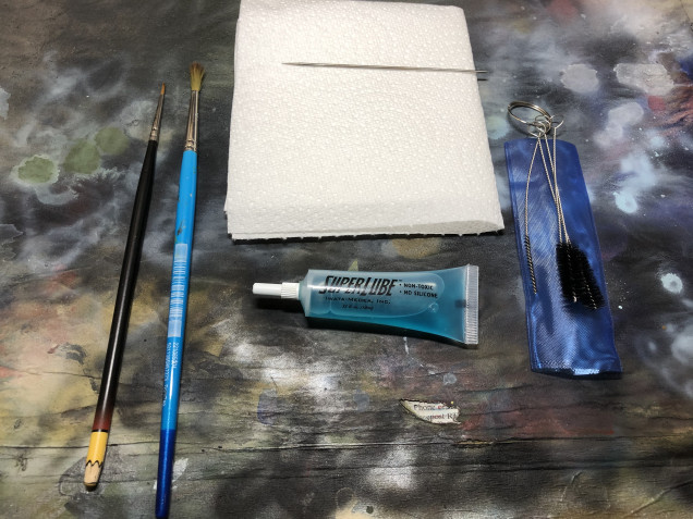 Cleaning stuff on standby, regular cleaning throughout your painting session is essential to stop the airbrush playing up on you and causing issues with your paint job.