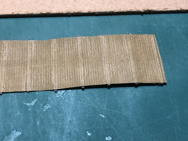Whilst i had the Iraqi sand out, i also used it to drybrush the bobbin matting. this really brought out the texture of the parcel paper i used.