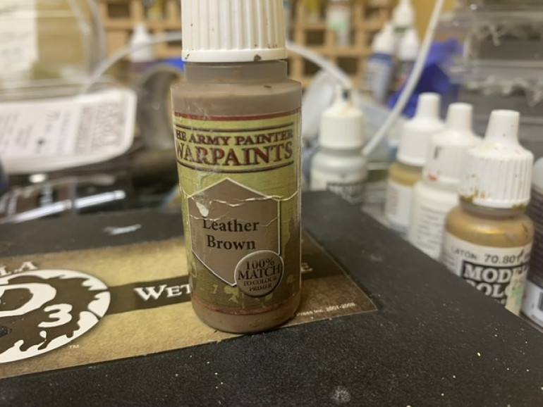 Once the glue dried I used Army Painter Leather Brown on the base. 