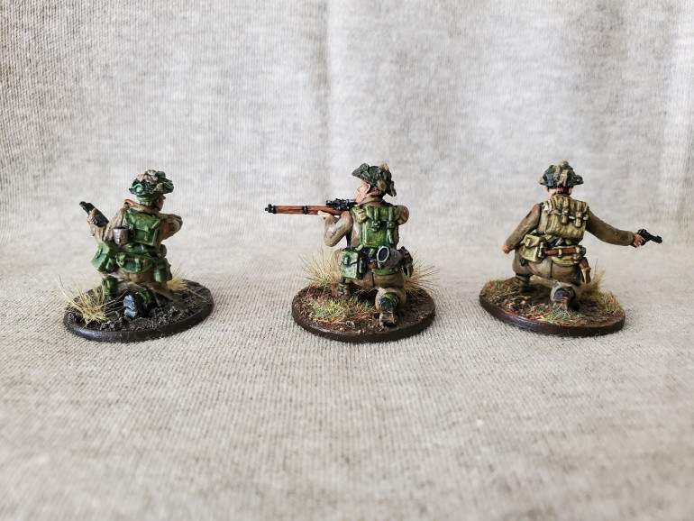 Same figure on the left, Sniper with the coat of Biel-Tan Green added, and the Spotter with just the one coat of Athonian Camoshade. This is where I noticed the original colour must have been two coats.