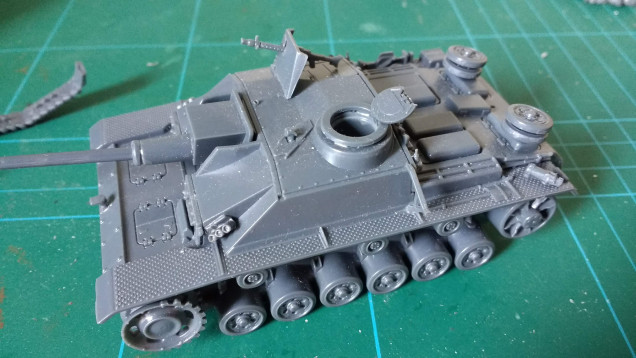 Its a Stug!  Not quite finished, I've modelled this with the hatch open but the tank commander just emphasises the difference in scale between the infantry and the vehicle so I am considering modifying it.. 