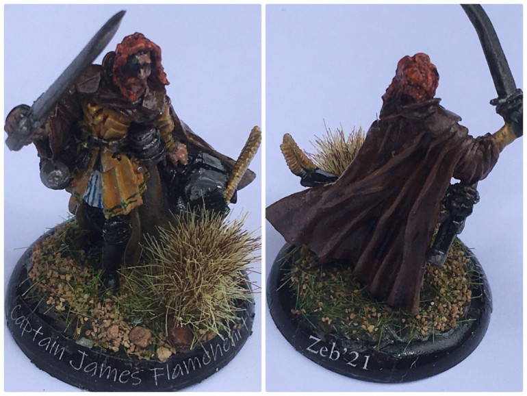 Captain James Flameheart… added a plumed hat from a Mordheim militia head and replaced the empty hand with a cutlass also from the Mordheim miniatures. Flocked grass and a gloss varnish to protect during play, and the group’s leader fits the swashbuckler role.