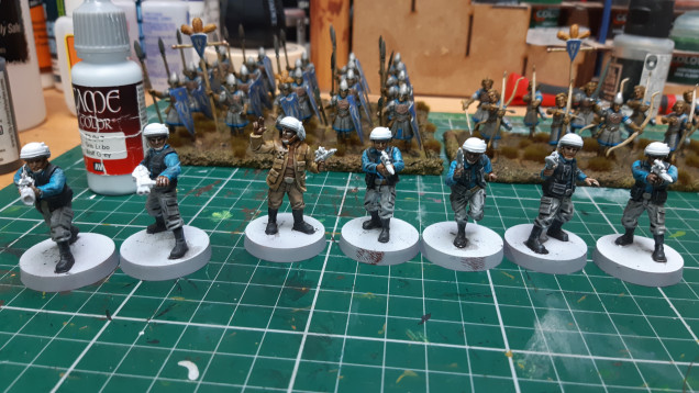 Nuln oil on clothes then dry brushed with bonewhite on the leader and then wolf grey dry brushed on  the rest. Then half the models got  dark fleshtone on skin and the other half got rakarth flesh. Followed by reikland flesh on all.