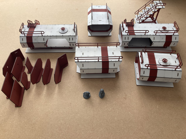 That’s the rest of the pods all painted and assembled, including internal divider walls. Miniatures shown for scale.