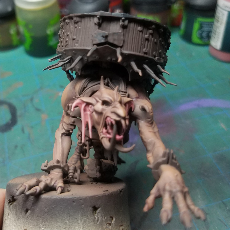 The pink ears and gums were base coated reddish flesh from the Vallejo pro fantasy line. The shadows were glazed in with burned flesh also Vallejo pro fantasy. And the highlights are flesh highlight by Vallejo pro fantasy.