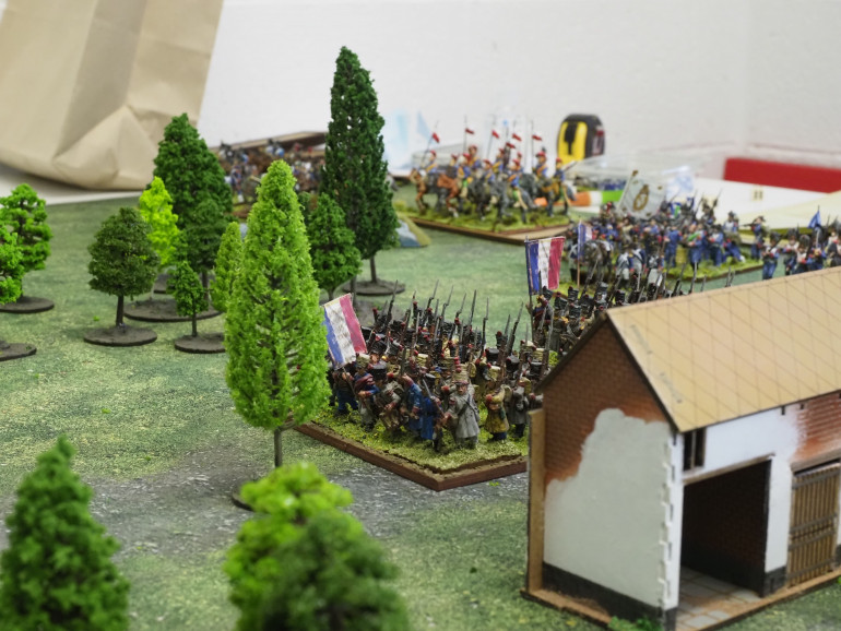 The French infantry in the center advance