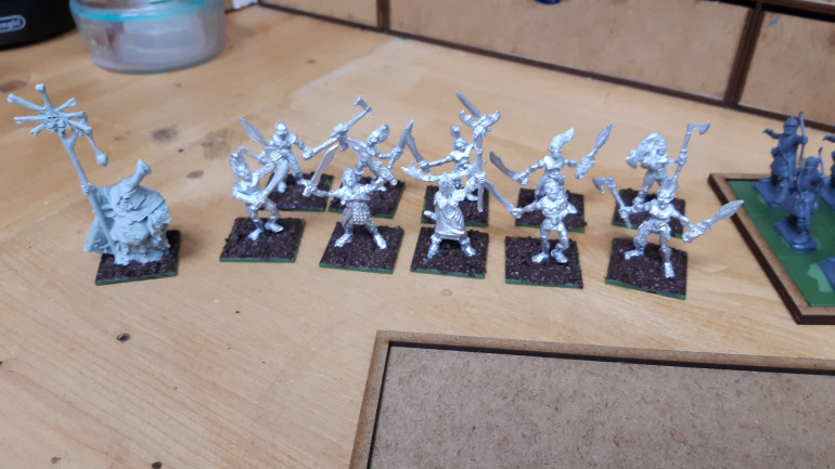 Some wood elves and late roman archers and  wizard for the army