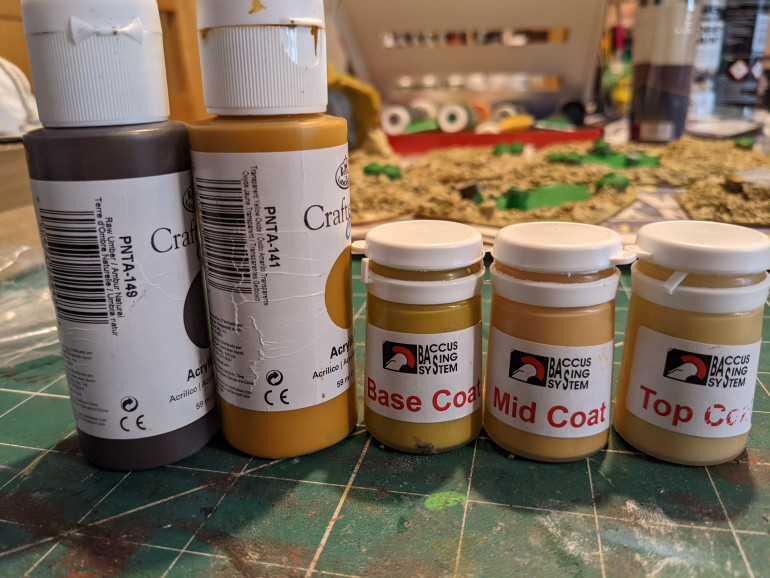 From left to right, first coat to last. The Baccus paint gives a nice dry sandy earth colour I think.