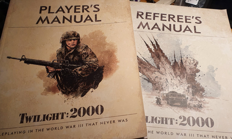 2 manuals, designed to look like era-correct military manuals