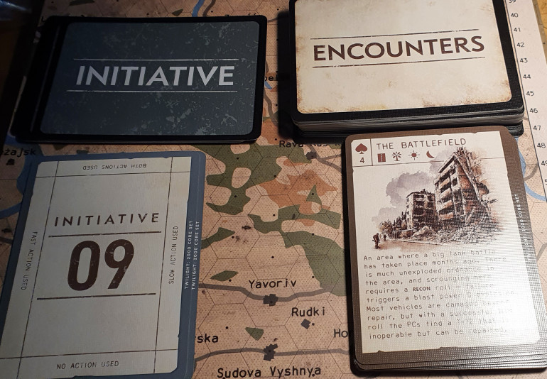 Encounter card and initiative cards. The encounter deck can also double up as a set of playing card