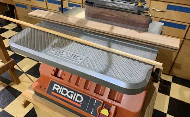 Rummaging around in my Dad's shop, I find some rounded dowels I can use for barrels and air jackets.  Using the belt sander, I can work on getting them to about the right width.