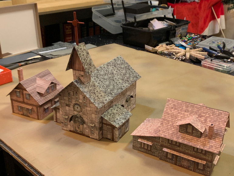 Two more houses and another church (smaller than the one already completed for this project).