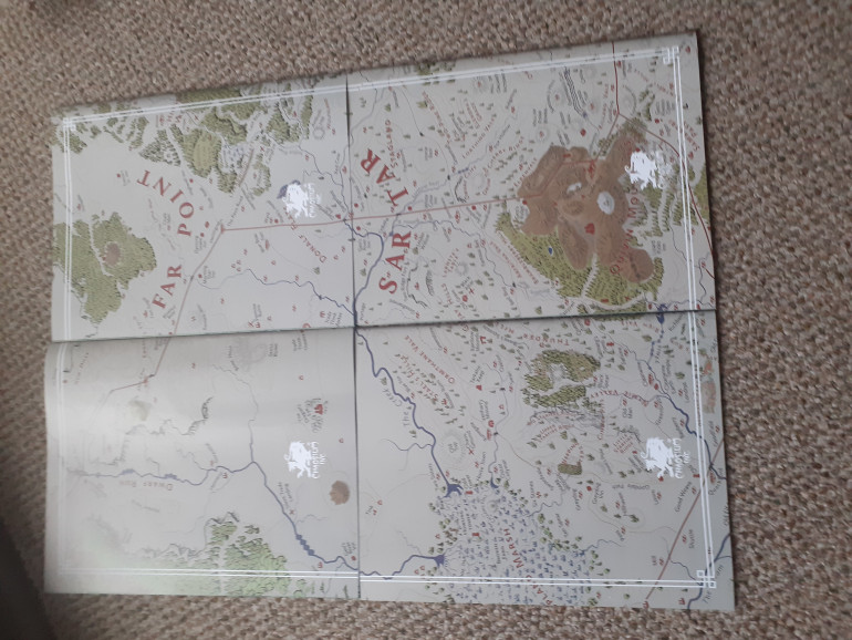 The backs of all the booklets form a map of Dragon Pass the prominent location for Runequest 