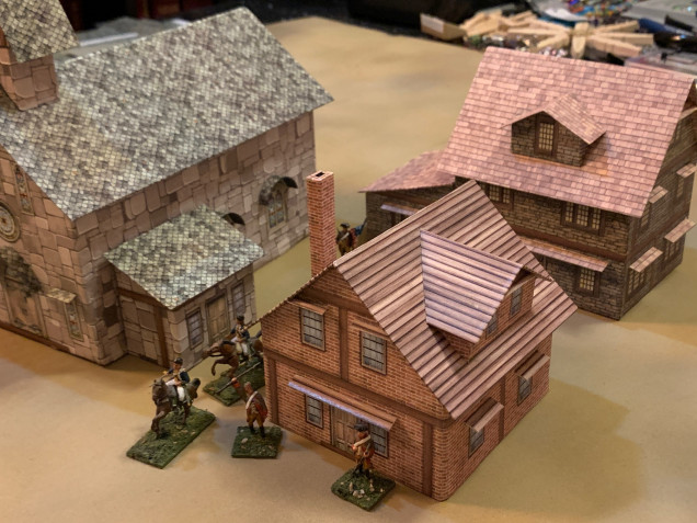 I find that on town / city / urban boards, the NUMBER of buildings is important because that's where you get your streets, alleys, corners, and tactical features for a good up-close shoot-out.  Anyway, just 1-2 more small buildings left and I'll then set up the whole 