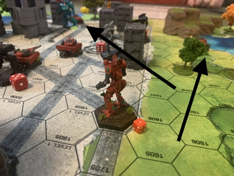 Arrows are pointing to the two Condor hover tanks. The one on the right was behind the hill on the right flank. The one on the extreme background snuck around the left side of the city wall. A Jenner light mech is about to get a rear shot on a Rommel. The two Rommels have joined up and have got the city’s central plaza covered with massive guns but they are extremely vulnerable to mobility hits.  The green mech is a Wolverine. The grey mech is a Spider and the black mech is a Panther. Both have lined up the pair of tanks. 