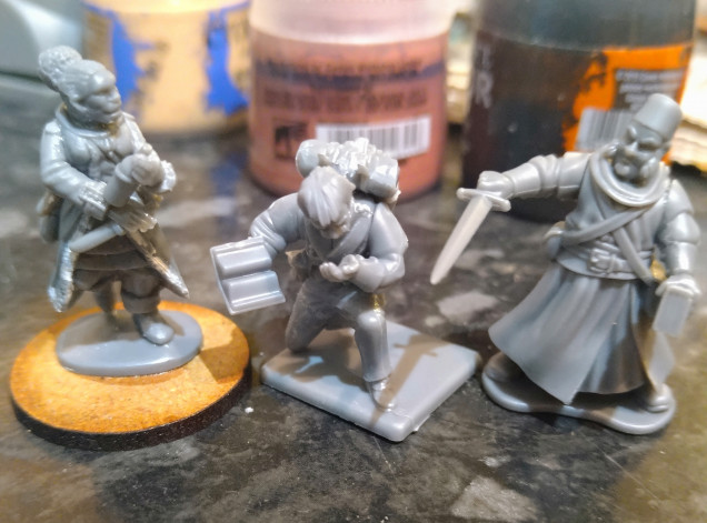 Kitbash fun. Vivandière on left. Frostgrave Soldiers 2 body and head, Victrix French arms and a bottle and knife from a Frostgrave wizard sprue. A supernatural investigator in the middle with a Victrix French body kneeling and Frostgrave Wizard arms. And an Occultist on the right. Thinking of ways to make him more Napoleonic, though painting the crossbelt white will be a start.